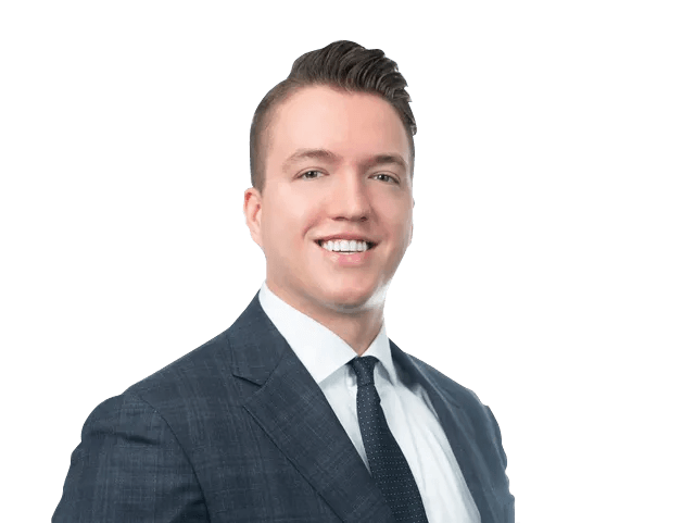 A man in a suit and tie is smiling for the camera.